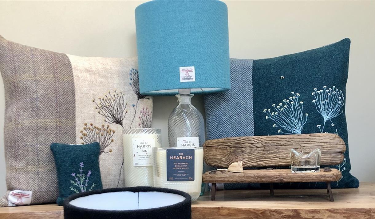 Various craft goods. Harris Tweed cushions, Harris Tweed Lampshades and Isle of Harris Gin candles Various craft goods. Harris Tweed cushions, Harris Tweed Lampshades and Isle of Harris Gin candles