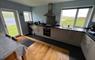 Fully furnished modern kitchen with stunning views across Loch Hosta and the hills beyond.