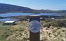 Uist Unearthed signpost with the Dun in the background