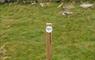 Uist Unearthed signpost in front of ruins