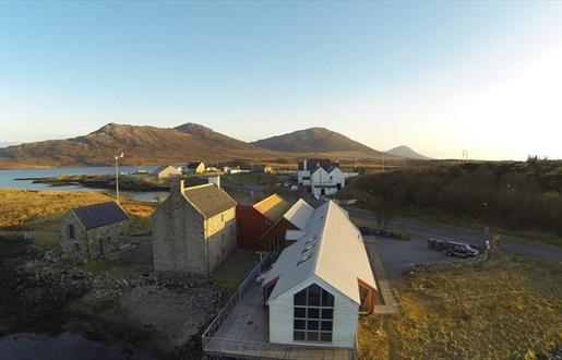 Aerial photo of the Taigh Chearsabhagh building, looking towards Lochmaddy Pier and Lee.