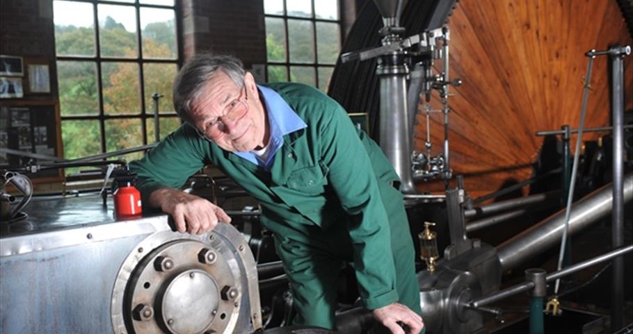 Picture of Harry and flywheel at Bancroft Mill