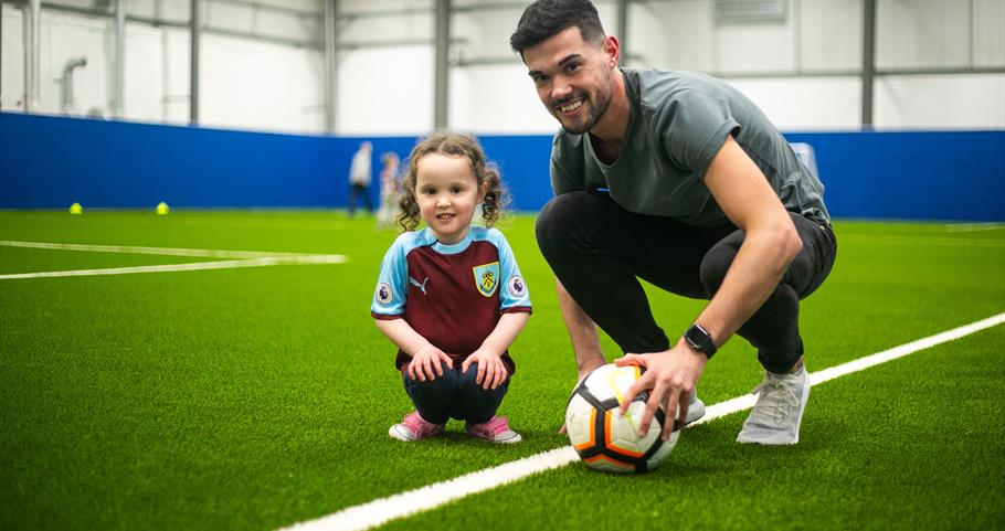 Picture of footballer and child at the Leisure Box Pendle