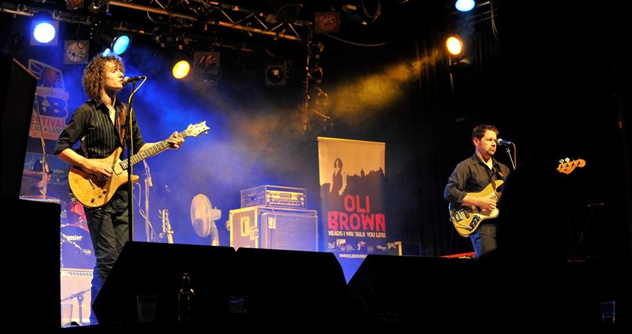 Picture of Oli Brown playing guitar at the Blues Festival