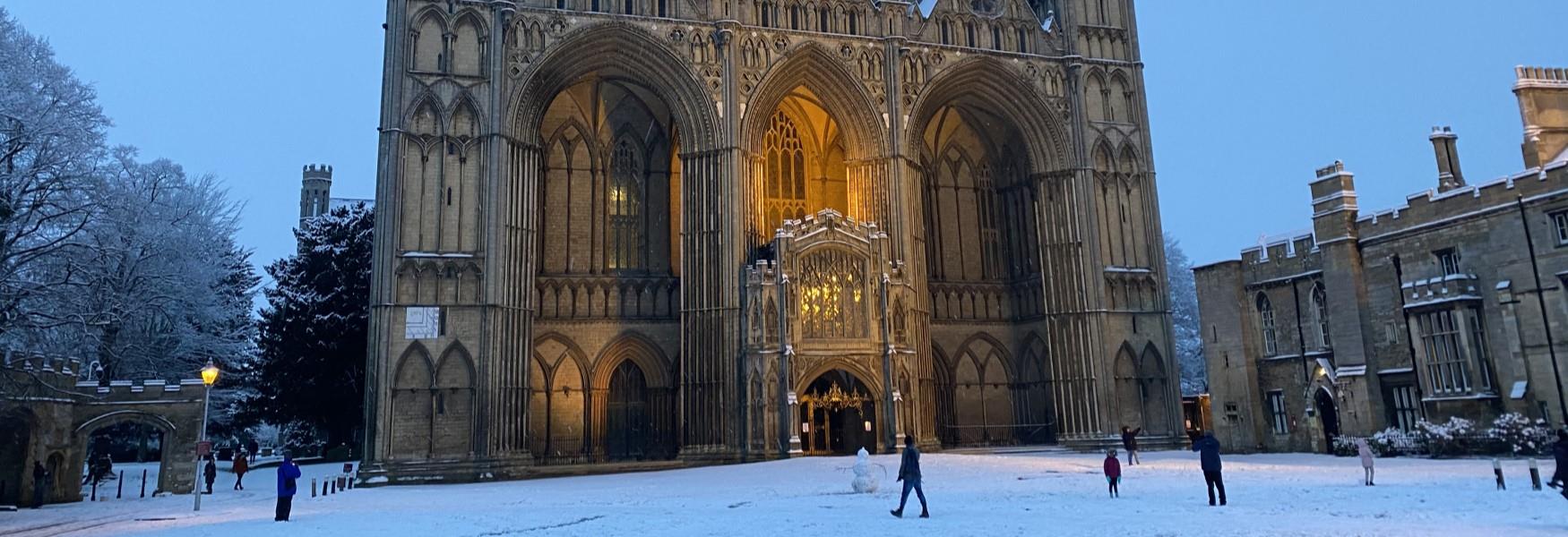 Peterborough cathedral west front in the snow