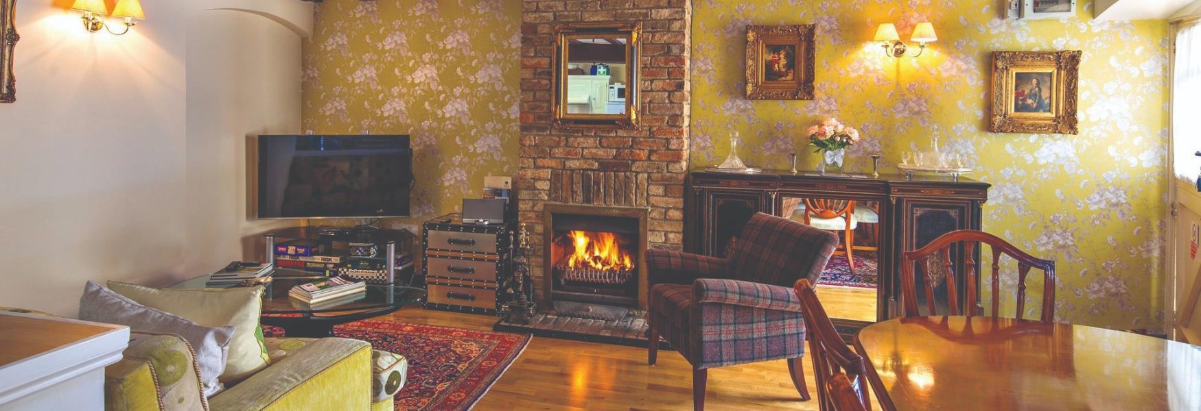 Cottage interior with open fireplace