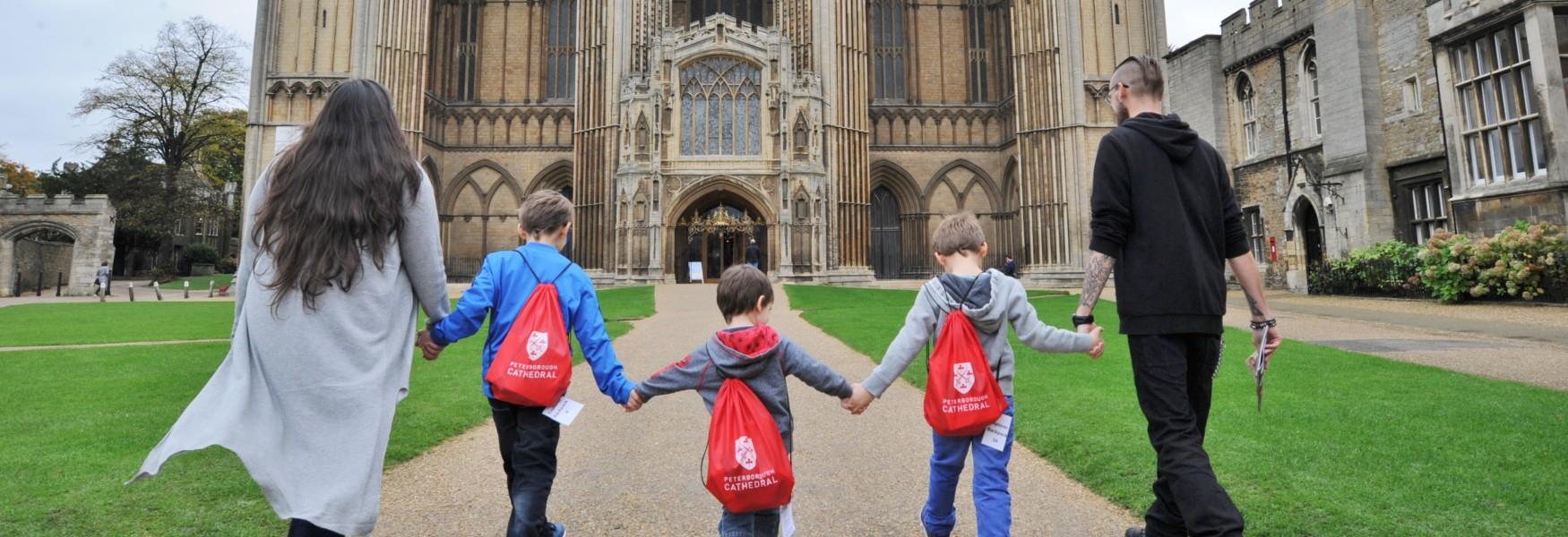 Family walking towards the Peterborough Cathedral