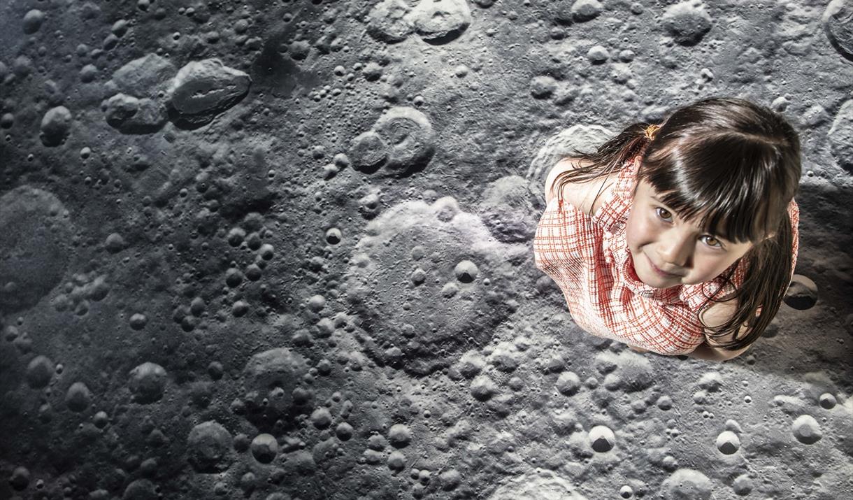 Small girl walks on moon
