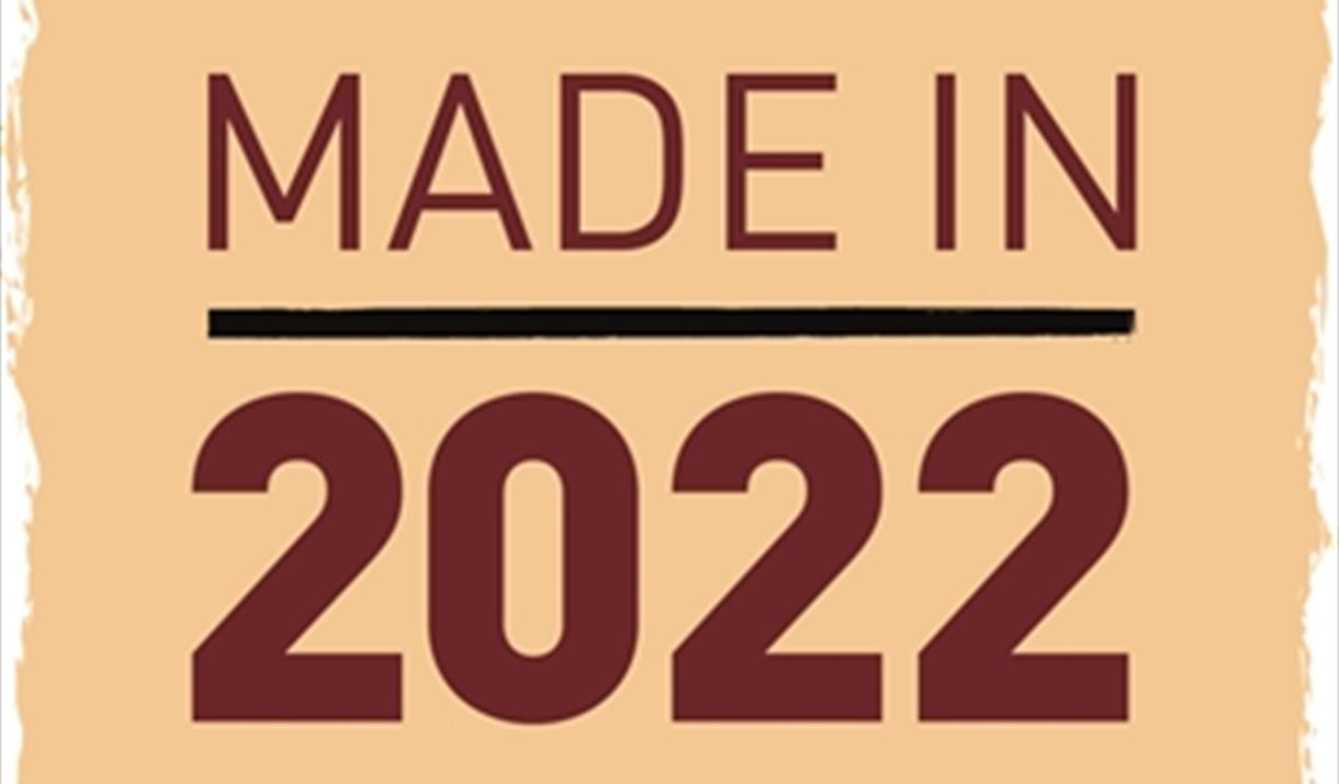 A yellow box with 'Made in 2022' written in red text.