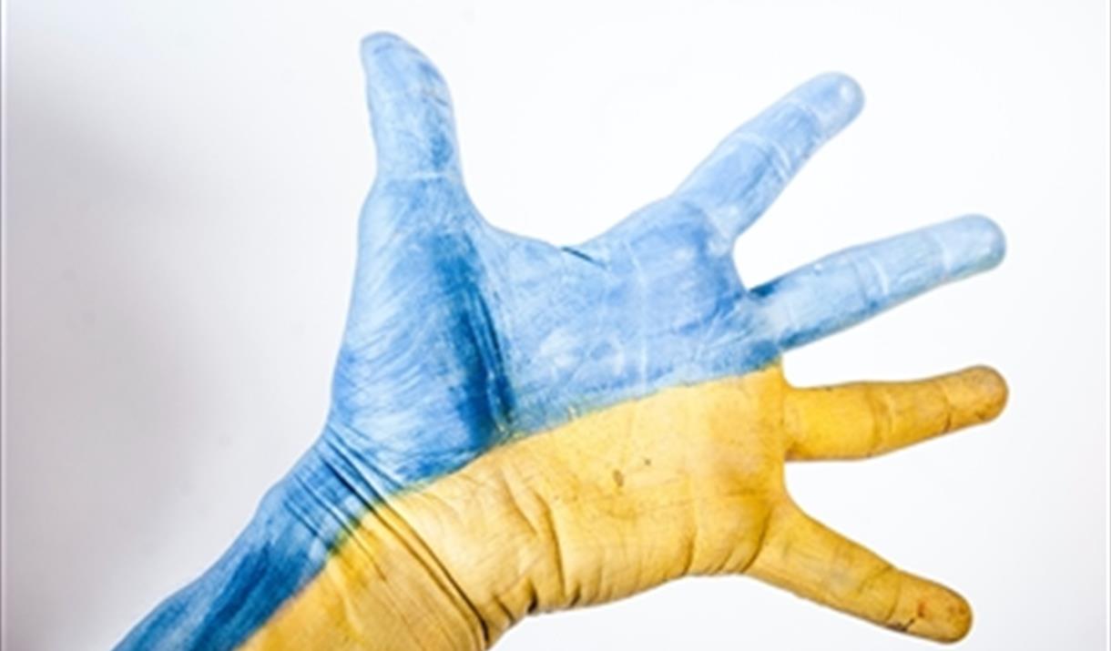 A hand painted as the Ukrainian flag