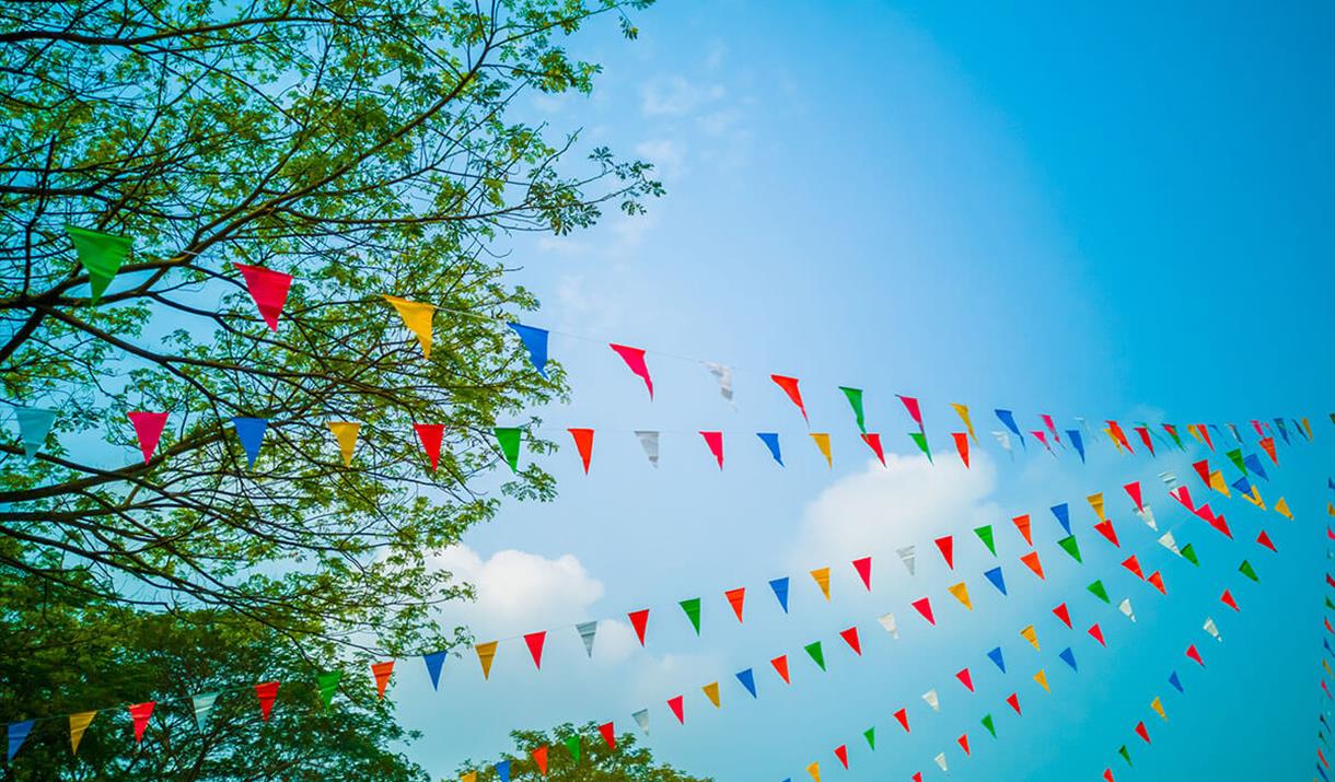 coloured bunting with blue sky.