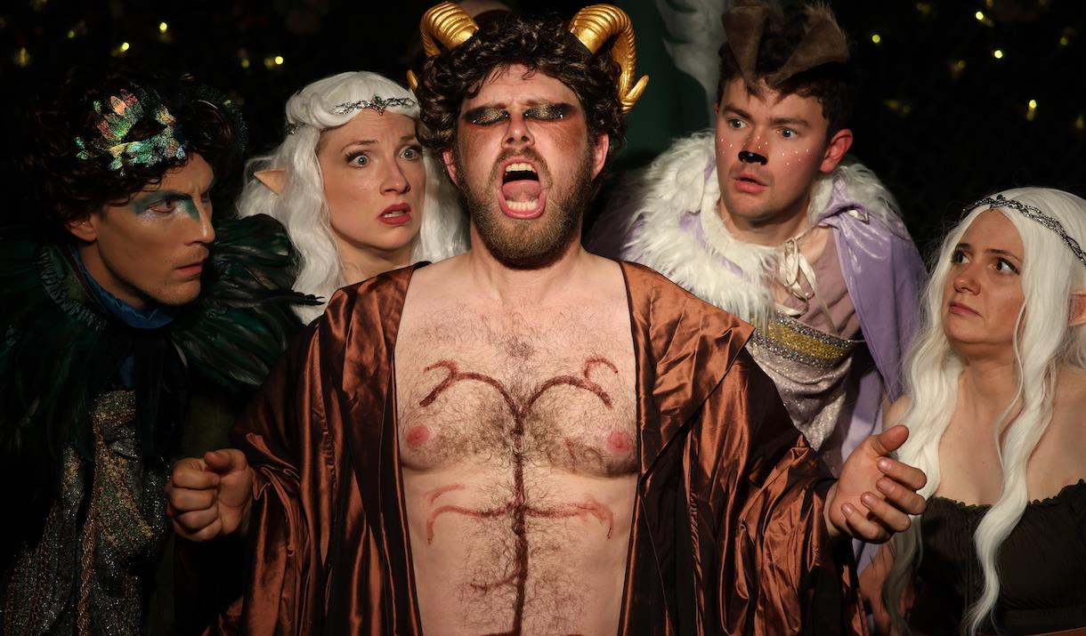 Elves and other mythical creatures look afraid of a singing satyr. Photo by Jon Lo Photography