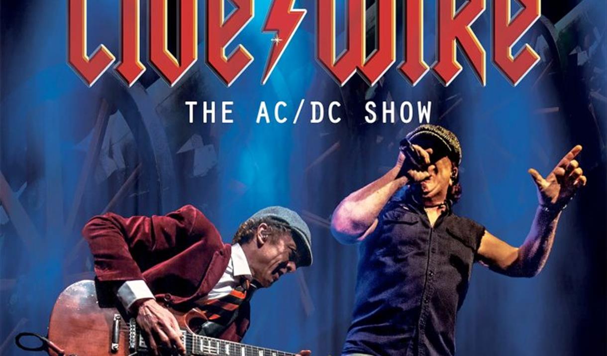 Image of Live/Wire performing on a blue background. Text reads: Live/Wire the AC/DC show.