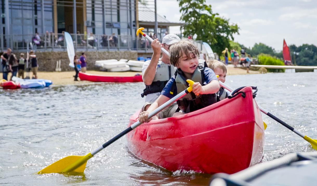A family canoeing in Ferry Meadows
