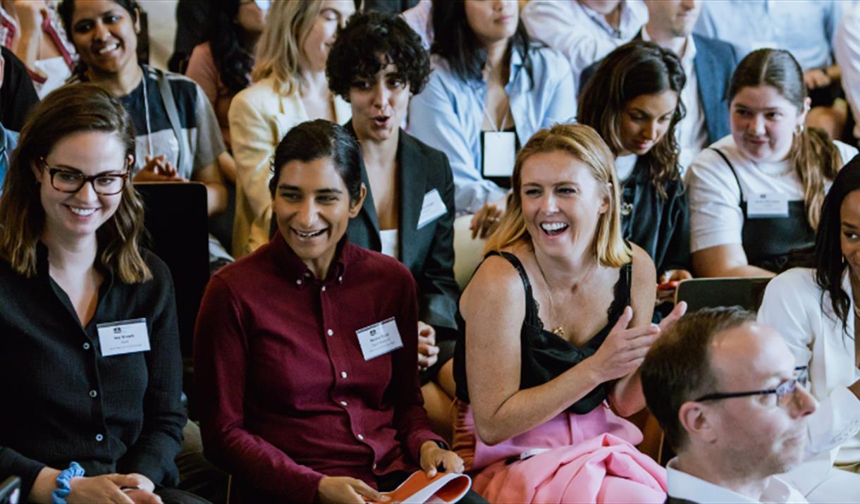 People applauding at a conference