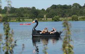 A family enjoys a pedalo ride in Ferry Meadows