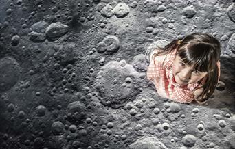 Small girl walks on moon
