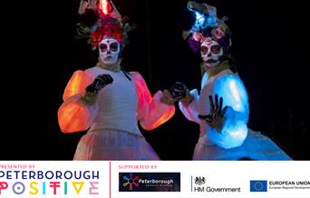 The illuminated Las Muertas stiltwalkers