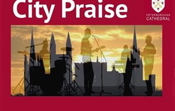 The cathedral is silhouetted against a sunset. An image of a band is overlaid.