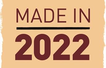 A yellow box with 'Made in 2022' written in red text.