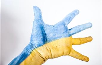 A hand painted as the Ukrainian flag