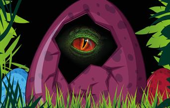 A hatched egg with a dinosaur's eye peeking through. Text reads 'I-spy-a-saurus'