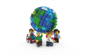Four Lego people holding up a Lego globe.
