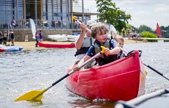 A family canoeing in Ferry Meadows