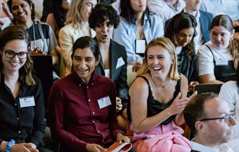 People applauding at a conference