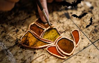 using stained glass to make props such as pumpkins