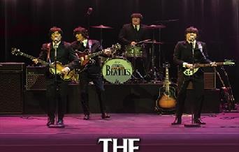 Image of a Beatles tribute band performing. Text reads: 'the Cavern Beatles'.