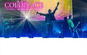 Coldpeace playing on stage with the word 'Coldpeace' in pink lettering