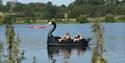 A family enjoys a pedalo ride in Ferry Meadows