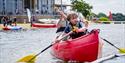 A family canoeing in Ferry Meadows