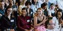 People applauding at a conference