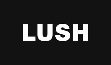 A black background with the word 'Lush' in white letters