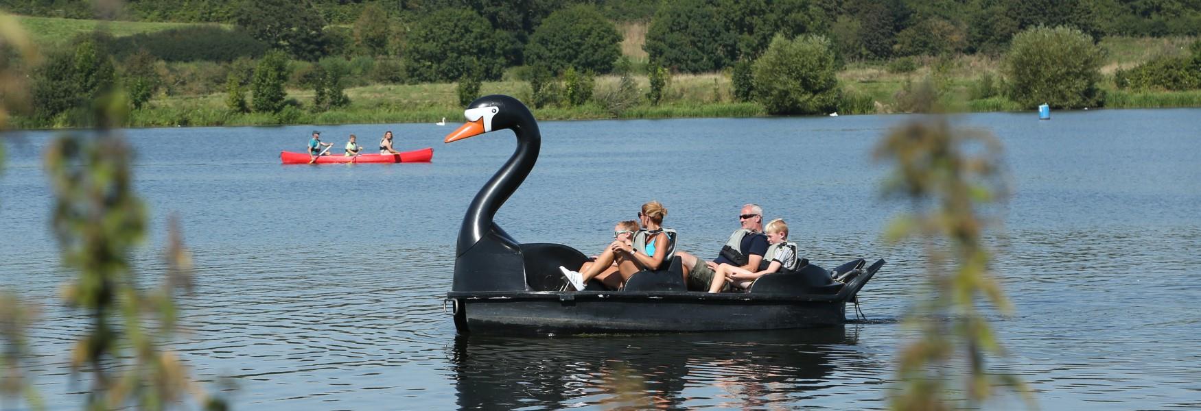 A family enjoying a pedalo ride at Ferry Meadows in Nene Park