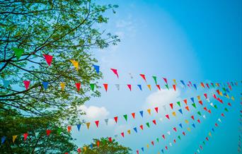 coloured bunting with blue sky.
