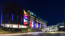 The outside of Drake Circus lit up 