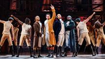 A photograph of the cast on the stage performing Hamilton 