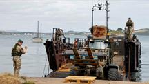 A Royal Marine boat delivers an historic cannon to Mount Edgcumbe in Cornwall