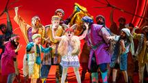 Cast of Joseph and his technicolour dreamcoat on a stage