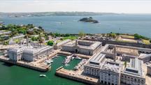 Aerial view of Royal William Yard’s historic waterfront buildings and marina.