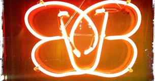 Brightly lit neon sign of the B-bar