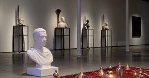 Photograph of a contemporary art installation, featuring sculptures.
