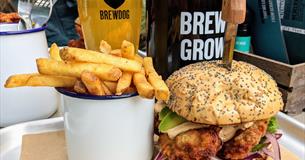 Cup of fries, burger and pint of BrewDog