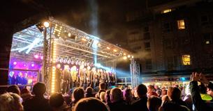 Performers on stage at Plymouth Christmas Lights Switch-on