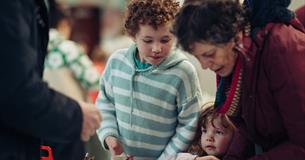 A family take part in a craft workshop at The Box Plymouth