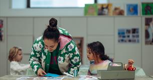 A parent and young girl take part in a craft activity at The Box Plymouth
