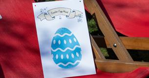 Royal William Yard Lawn with Easter bunnies and a sign saying Easter Egg hunt